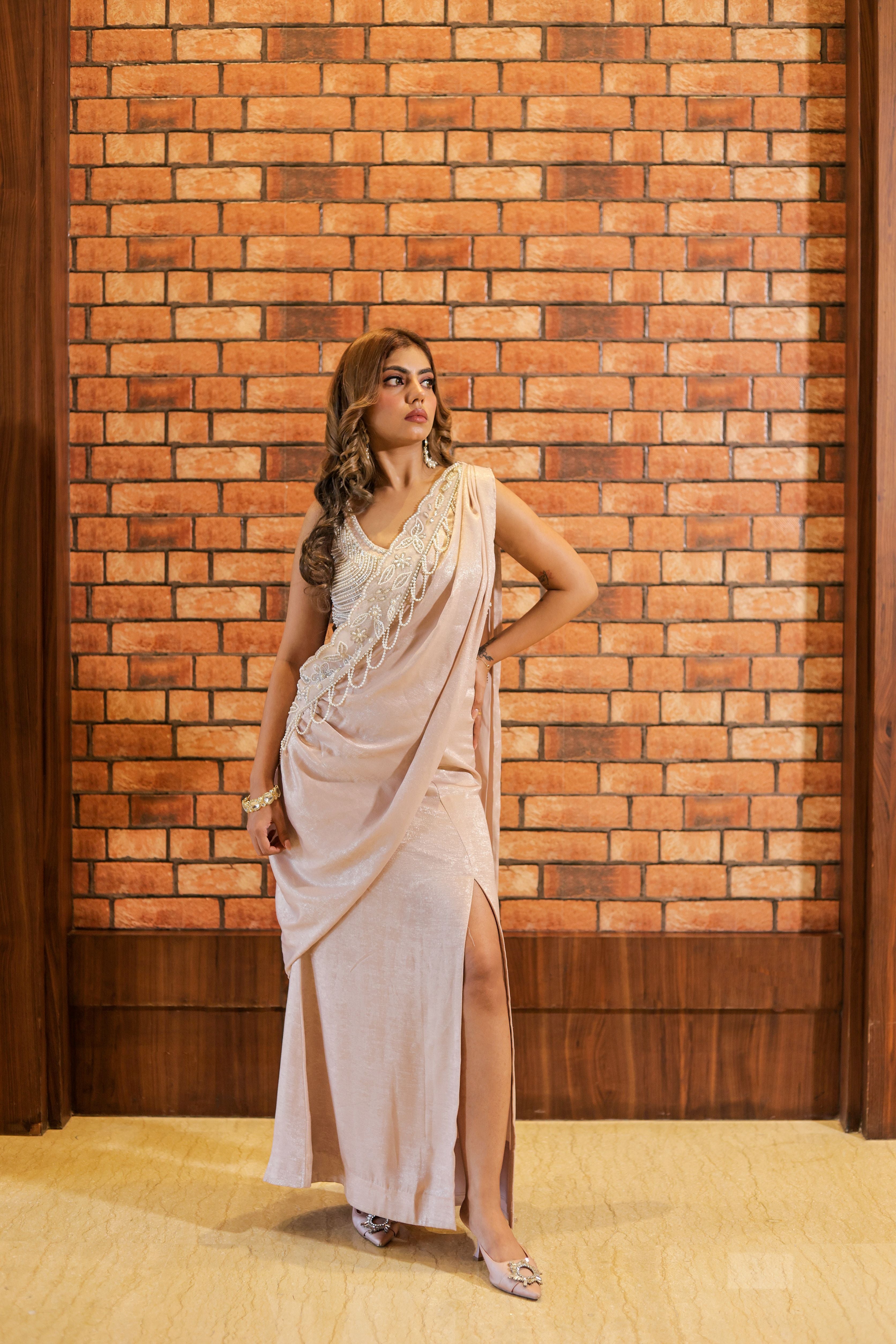 Pink drape saree with pearl work blouse