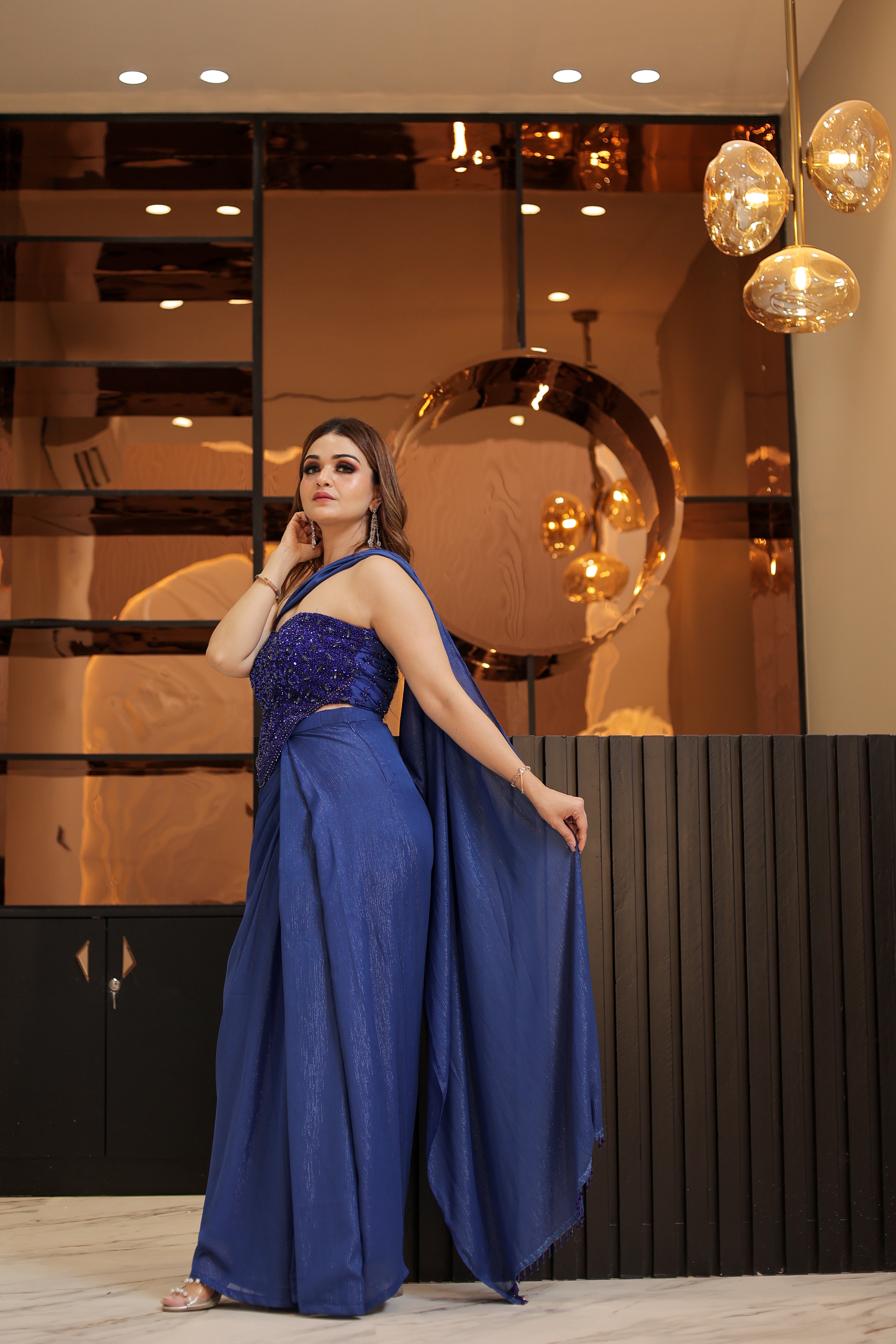 Blue crystal work corset blouse with drape skirt and trail
