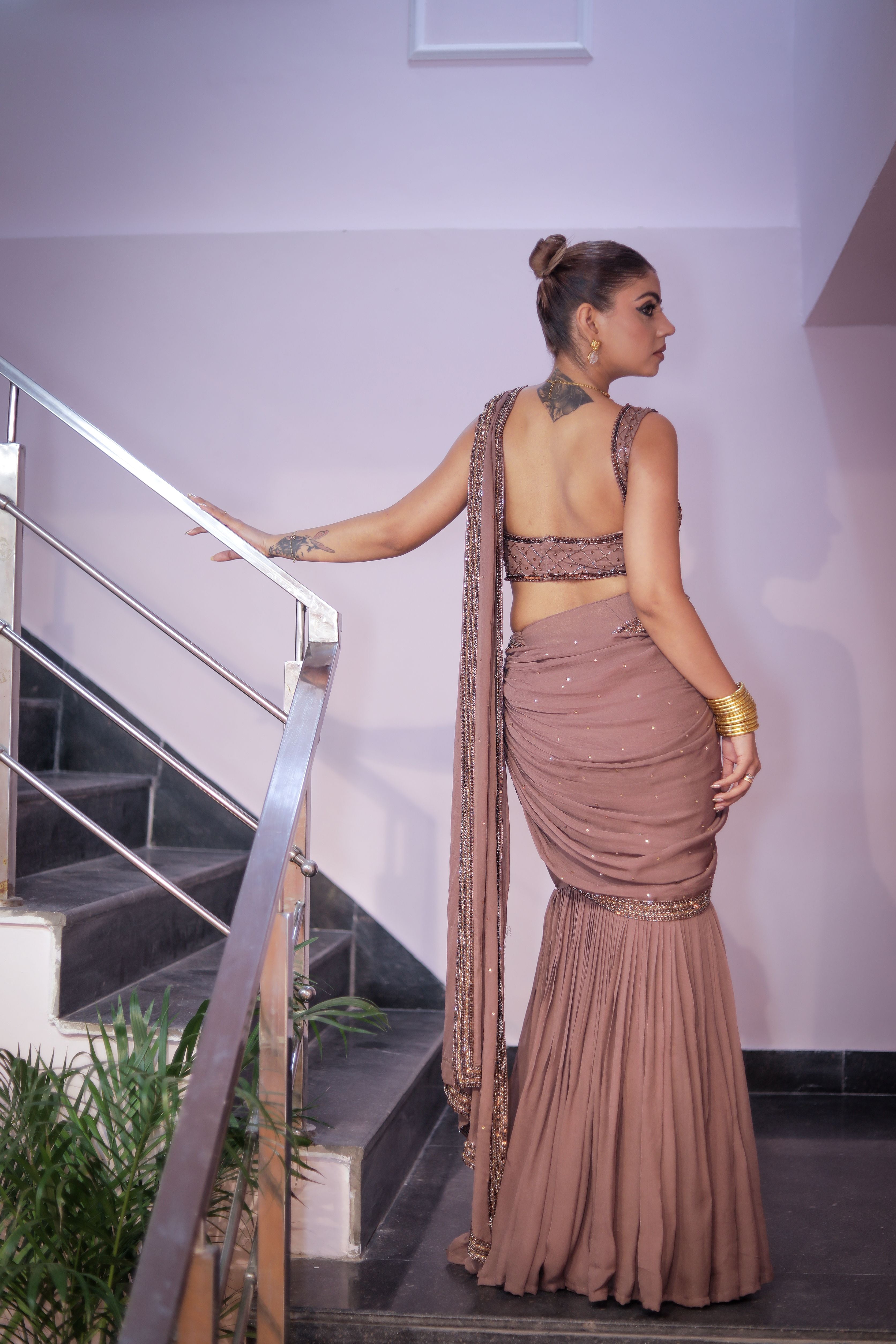 Nudish pink heavy blouse with drape saree