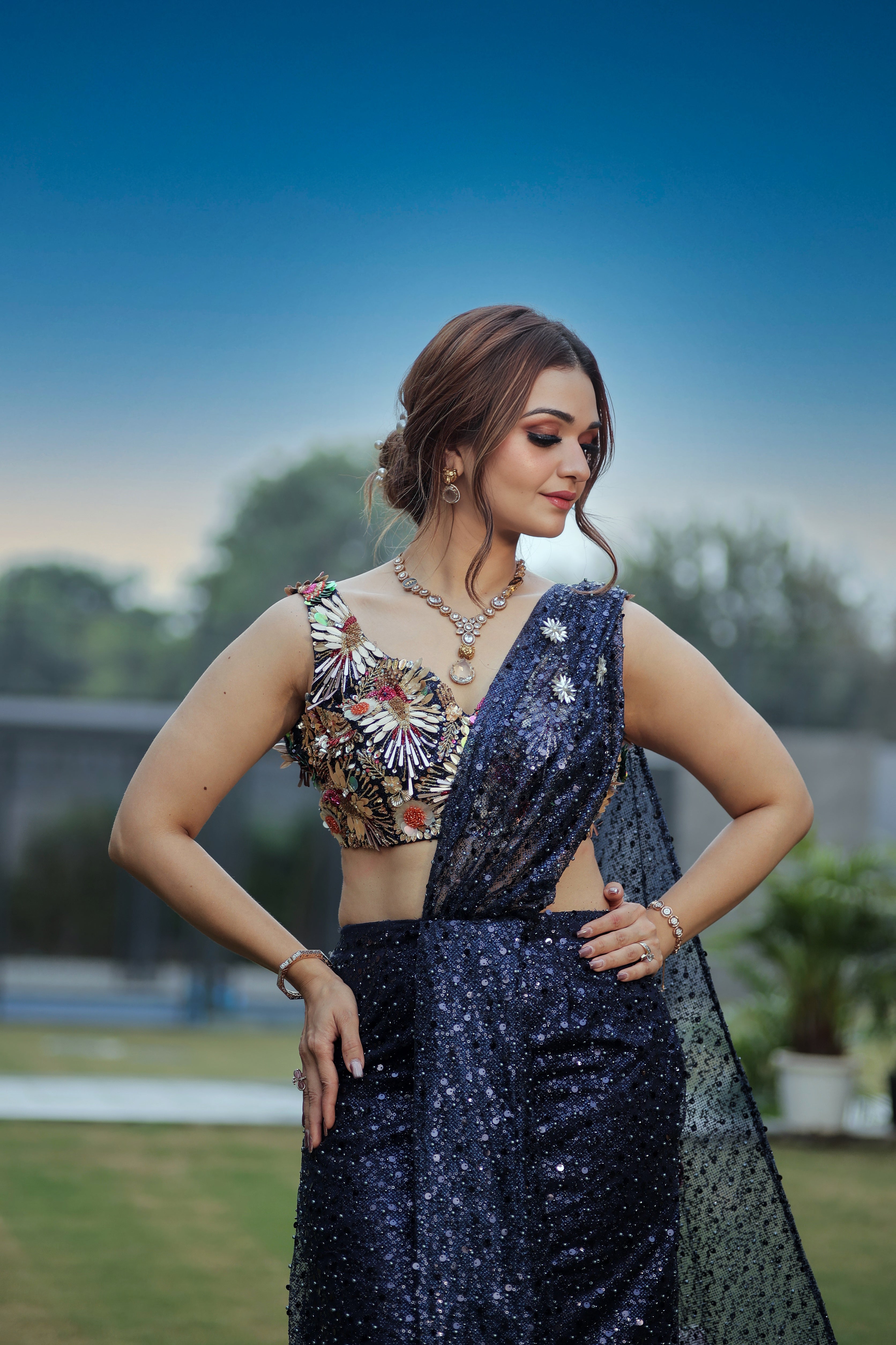 Blue sequin pearl drape saree with hand embroidered bird blouse