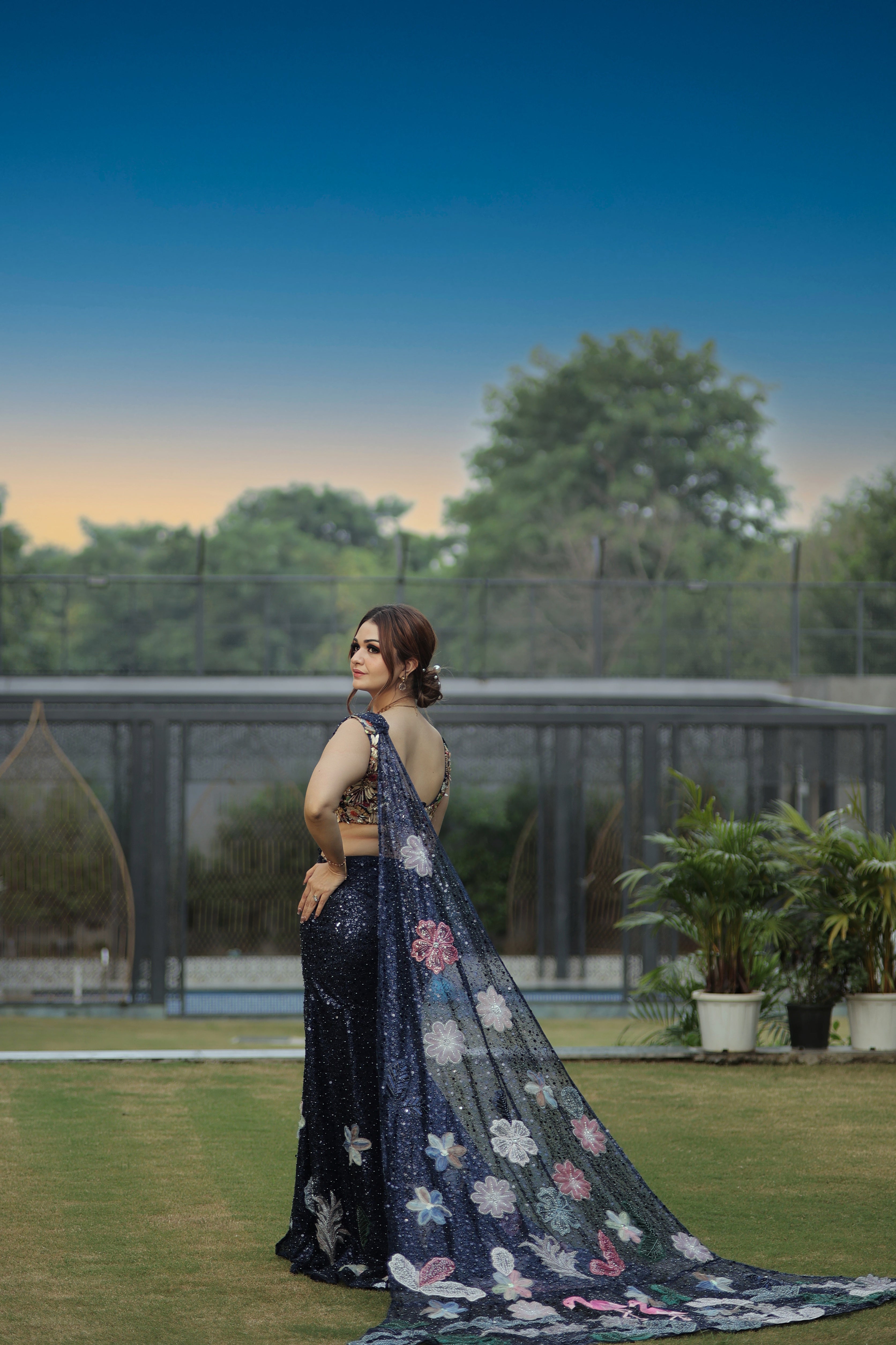 Blue sequin pearl drape saree with hand embroidered bird blouse