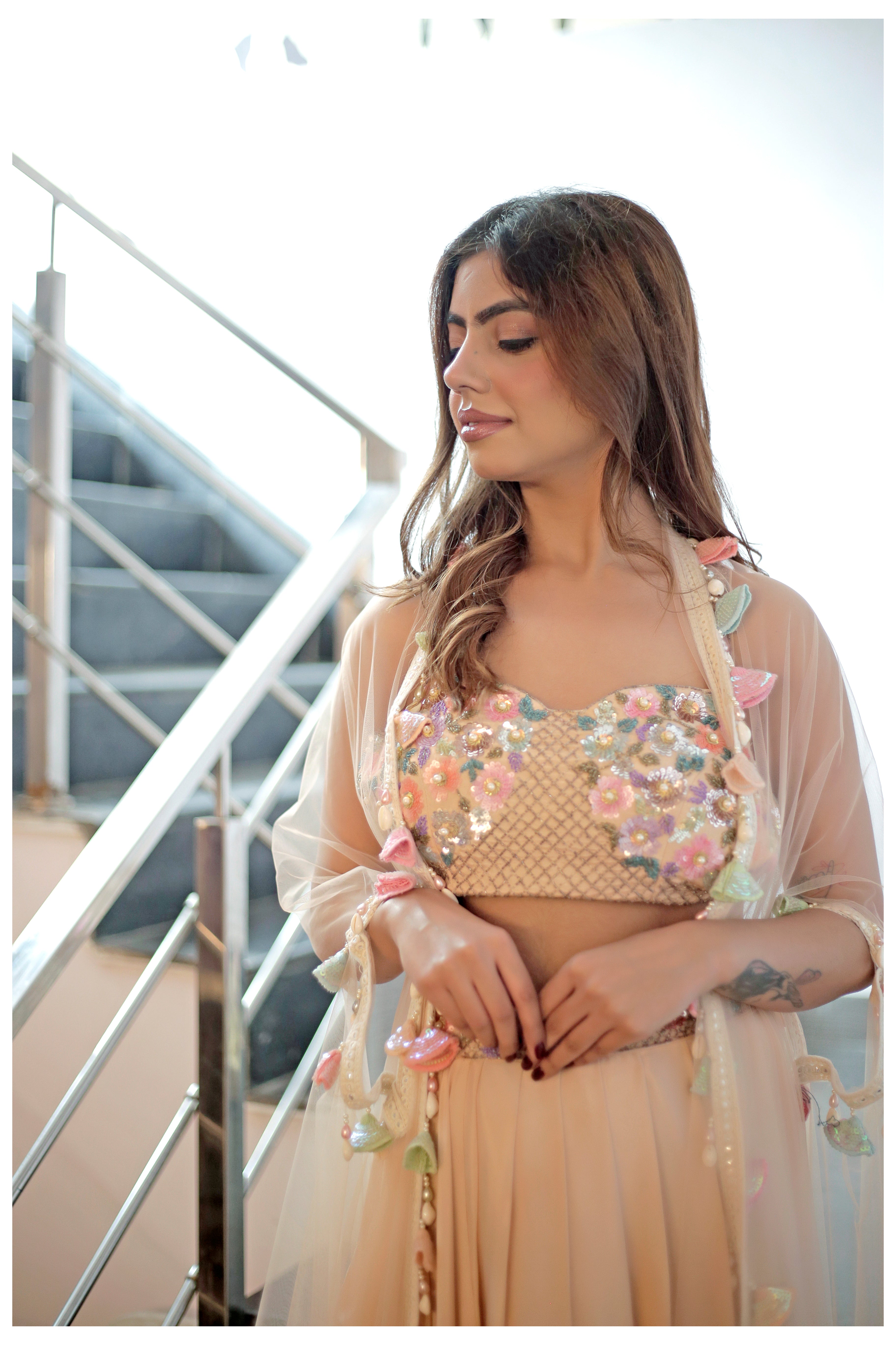 Hand embroidered crop top with drape skirt and shell detailed cape